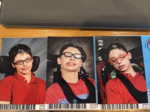3 years of school pictures with male preteen in red shirts