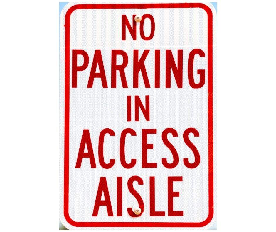 white street sign with red letters "no parking in access aisle"