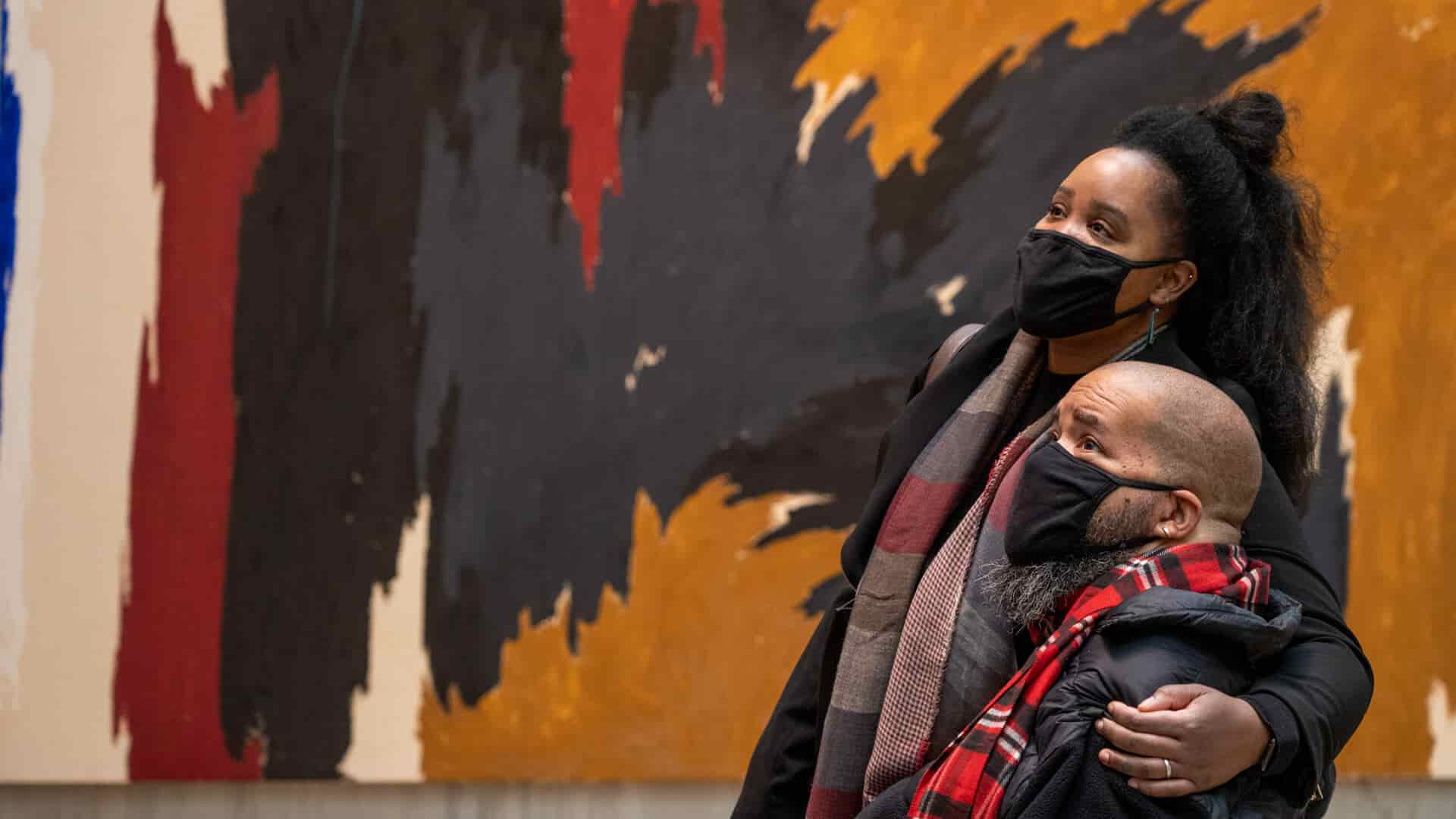 Man in wheelchair and partner enjoying the accessible activity in Colorado; The Clyfford Still Museum