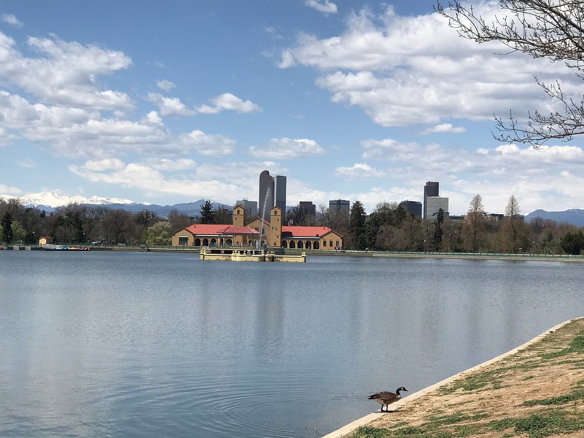 city park lake and boathouse with denver skyline in the background
