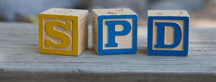 wooden blocks with the letters S, P, and D